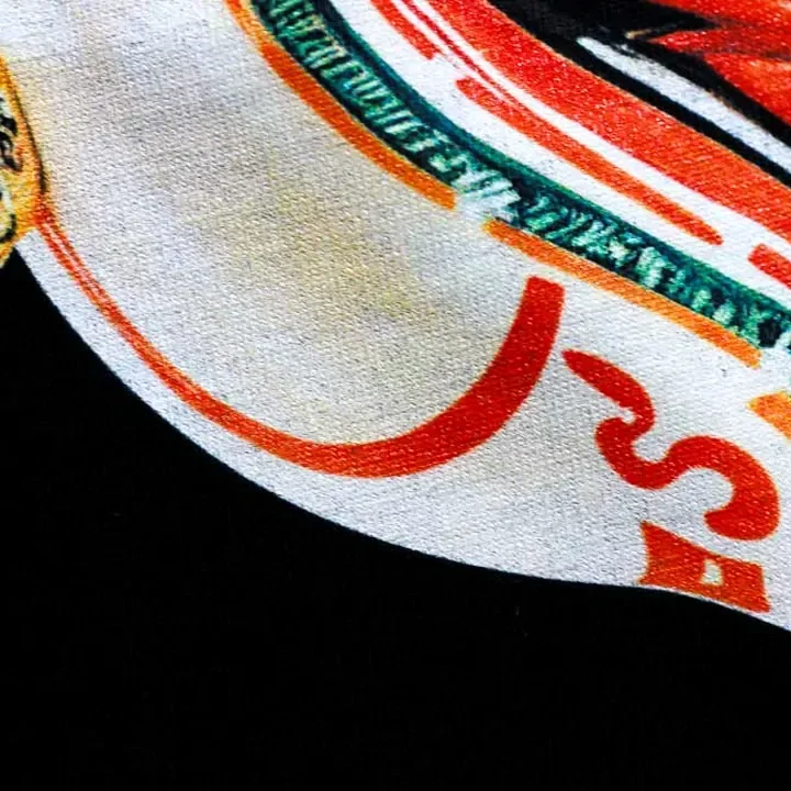 ตัวอย่างรายละเอียดงานสกรีน DTG บนเสื้อสีดำจาก Cottonique DTG