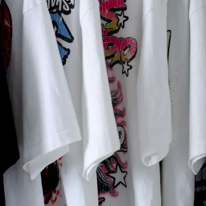 ตัวอย่างรายละเอียดงานสกรีน DTG บนเสื้อสีดำจาก Cottonique DTG